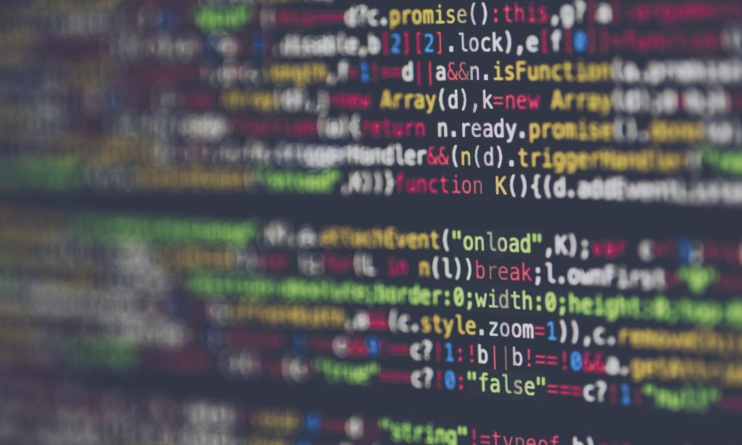 Advanced testing environment with multiple monitors showing code analysis